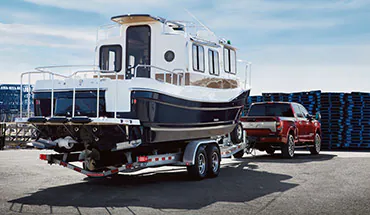 2022 Nissan TITAN Truck towing boat | Waxahachie Nissan in Waxahachie TX